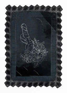 An embroidered erection sprouting from a bunch of flowers. White and embroidery on black dyed and spray died linen with a black lace trim.
