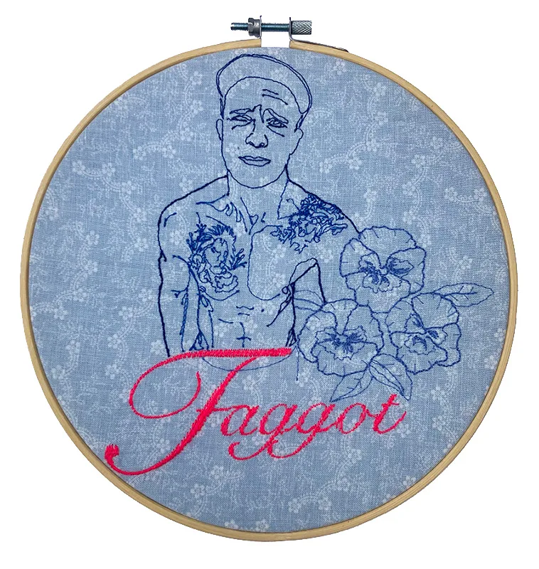 Embroidered self portrait on a pale blue, floral fabric. Embroidered pansies. Machine embroidered text spelling the word Faggot, displayed in an embroidery hoop.